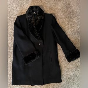 Woman’s mid length wool coat with faux fur collar and cuffs